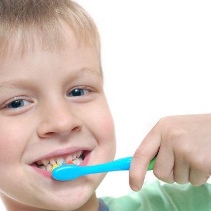 child maintaining oral health by brushing teeth